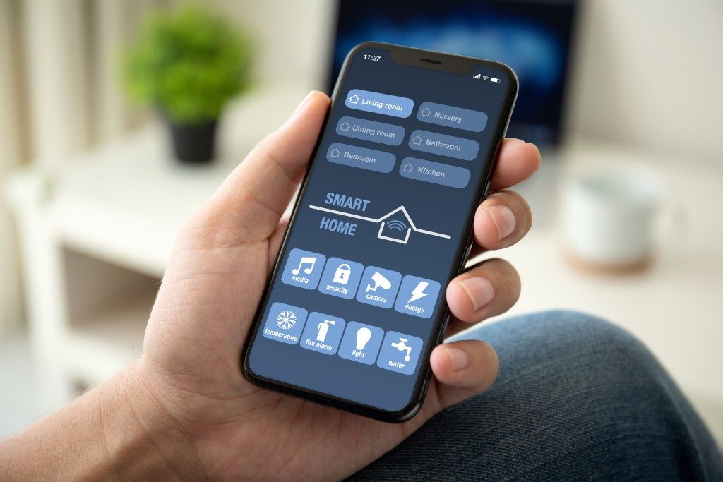 picture of smart phone controlling all smart devices in home